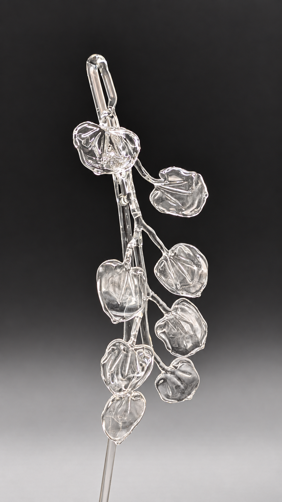 Clear-glass Katsura wand with a branch of heart-shaped leaves made by Stephanie Tayengco